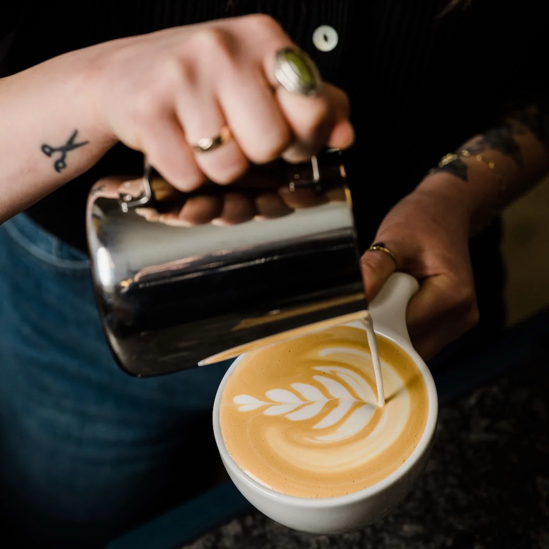 I’ll pour some cool latte art for the first customer today. After that, you get what you get.